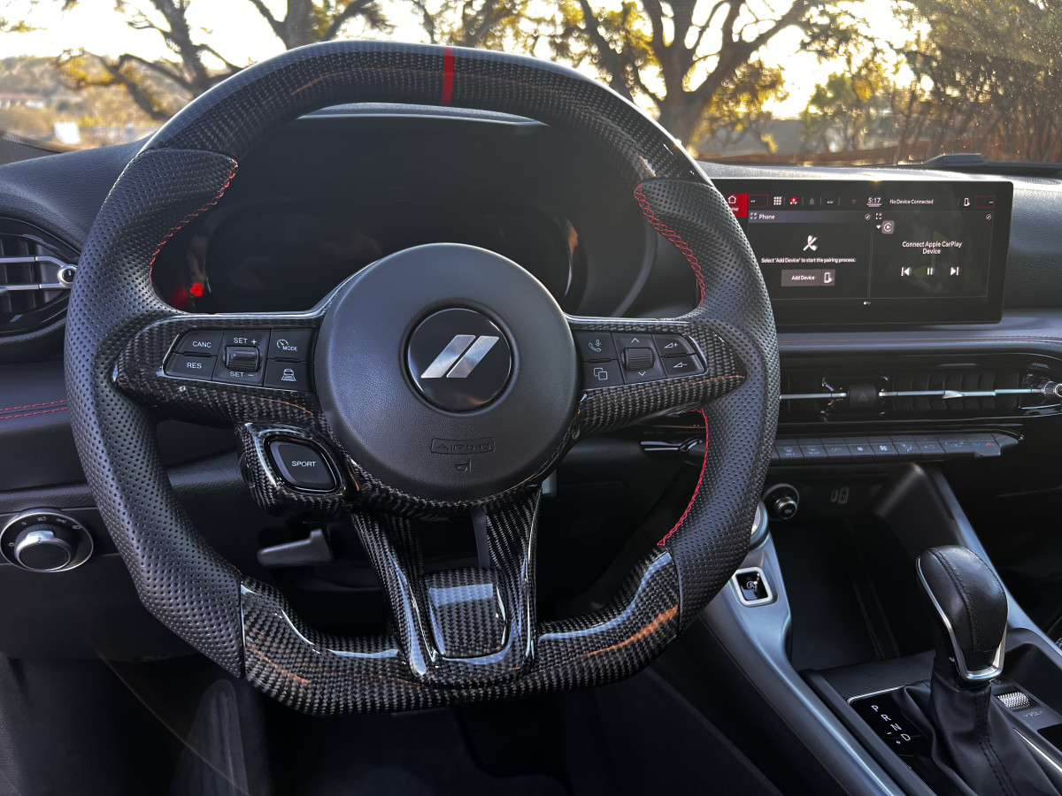 Dodge Hornet Custom Steering Wheel - Carbon Fiber - Flat Top/ Flat Bottom - w/ 2 Red Center Stripes - Perforated Leather Dodge Hornet Custom Steering Wheel - Carbon Fiber - Flat Top/ Flat Bottom - w/ 2 Red Center Stripes - Perforated Leather